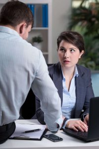 woman and man talk in the office